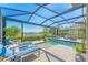 Fantastic pool area with tanning ledge, serene views, and lounge seating at 7643 Haddington Cv, Bradenton, FL 34202