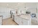 Open kitchen with stainless steel appliances and large center island at 850 Tidewater Shores Loop # 202, Bradenton, FL 34208