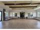Spacious lounge with ample seating, modern lighting, and sleek flooring, perfect for social gatherings at 850 Tidewater Shores Loop # 202, Bradenton, FL 34208