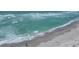 Scenic beach view with calm turquoise waters and soft sand for relaxation and recreation at 8710 Midnight Pass Rd # 202, Sarasota, FL 34242