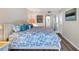 Comfortable bedroom with a queen bed, stylish decorations and lamps on each side at 8710 Midnight Pass Rd # 202, Sarasota, FL 34242