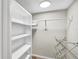 Walk-in closet has built in shelves and space for storage of clothes and accessories at 8710 Midnight Pass Rd # 202, Sarasota, FL 34242