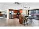 Spacious kitchen boasts a granite island and stainless steel appliances in a community setting at 8710 Midnight Pass Rd # 202, Sarasota, FL 34242
