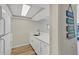 Bright white kitchen with stainless steel appliances, updated countertops, and decorative accents for a clean, beachy feel at 8710 Midnight Pass Rd # 202, Sarasota, FL 34242