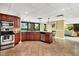 Well-equipped kitchen features dark cabinetry, stainless steel appliances, and outdoor views at 8710 Midnight Pass Rd # 202, Sarasota, FL 34242