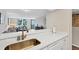 Beautiful kitchen with updated counters, stainless steel appliances, and an open view into the living area at 8710 Midnight Pass Rd # 202, Sarasota, FL 34242