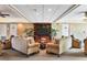 Comfortable lobby with couches, chairs, and a TV for resident use at 8710 Midnight Pass Rd # 202, Sarasota, FL 34242