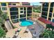 Beautiful pool area with comfortable seating and meticulously maintained grounds at 8710 Midnight Pass Rd # 202, Sarasota, FL 34242