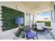 Inviting balcony with comfortable seating, privacy screen, and stylish decor, creating a relaxing outdoor space at 6314 Bay Cedar Ln # 201, Bradenton, FL 34203