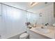 Cozy bathroom featuring a shower, toilet, vanity with sink, and a large mirror at 6314 Bay Cedar Ln # 201, Bradenton, FL 34203