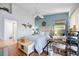 Charming bedroom with blue accent wall, hardwood floors, and white furniture at 6314 Bay Cedar Ln # 201, Bradenton, FL 34203