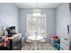 Charming breakfast nook featuring a round table set and bright natural light from a nearby window at 6314 Bay Cedar Ln # 201, Bradenton, FL 34203