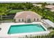 Community pool featuring clear water, sun loungers, and well-maintained surroundings at 6314 Bay Cedar Ln # 201, Bradenton, FL 34203