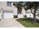 Inviting townhome featuring a well-manicured lawn and a private entrance with a one-car garage at 6314 Bay Cedar Ln # 201, Bradenton, FL 34203