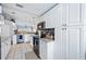 Well-lit kitchen with white cabinets, stainless steel appliances, and granite countertops at 6314 Bay Cedar Ln # 201, Bradenton, FL 34203