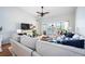 Comfortable living room featuring a large sofa, decorative pillows, hardwood floors, and a view to the screened patio at 6314 Bay Cedar Ln # 201, Bradenton, FL 34203