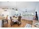 Open living space with dining area, hardwood floors, and bright natural light, creating an inviting atmosphere at 6314 Bay Cedar Ln # 201, Bradenton, FL 34203