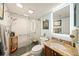 Updated bathroom with a glass shower, granite vanity, and modern fixtures at 101 Sunset Dr # 102, Sarasota, FL 34236