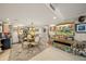 Inviting dining area with a view and a unique antique chandelier at 101 Sunset Dr # 102, Sarasota, FL 34236