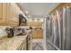Bright, modern kitchen featuring stainless steel appliances and granite countertops at 101 Sunset Dr # 102, Sarasota, FL 34236