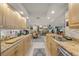 Beautiful kitchen featuring stone countertops, light-colored cabinetry, and stainless steel appliances at 101 Sunset Dr # 102, Sarasota, FL 34236