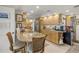 Elegant kitchen boasts a breakfast bar, stainless steel appliances and custom cabinetry at 101 Sunset Dr # 102, Sarasota, FL 34236