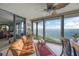 Bright living room with comfortable seating and expansive windows showcasing beautiful ocean views at 101 Sunset Dr # 102, Sarasota, FL 34236