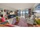 Cozy living room with a flat screen TV and ocean view at 101 Sunset Dr # 102, Sarasota, FL 34236