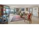 Spacious living room with comfortable seating, dining area, and ocean views at 101 Sunset Dr # 102, Sarasota, FL 34236