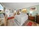 Comfortable bedroom with natural light and ample storage with an adjacent bath at 101 Sunset Dr # 102, Sarasota, FL 34236