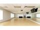 Spacious studio with mirrored wall, wood floor, and natural lighting at 10111 Malachite Dr, Bradenton, FL 34211