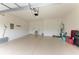 Spacious garage with epoxy flooring, overhead door, utility sink and plenty of storage space at 10111 Malachite Dr, Bradenton, FL 34211