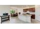 Open kitchen featuring a center island, stainless steel appliances, and a dining table for Gathering meals at 10111 Malachite Dr, Bradenton, FL 34211