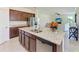 Kitchen island featuring granite countertops, stainless steel appliances, and lots of storage and prep space at 10111 Malachite Dr, Bradenton, FL 34211