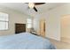 Comfortable main bedroom boasts neutral colors, wood-look flooring, and a door to the ensuite bathroom at 10111 Malachite Dr, Bradenton, FL 34211