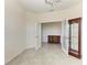 Bright office featuring glass French doors, a display cabinet, and a view into another room at 10111 Malachite Dr, Bradenton, FL 34211
