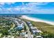Coastal homes, community, and the beach from an aerial view at 1020 Sun N Sea Dr # 104B, Sarasota, FL 34242