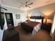 Comfortable bedroom with ceiling fan, warm lighting, and modern decor for a relaxing ambiance at 1020 Sun N Sea Dr # 104B, Sarasota, FL 34242