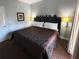 Relaxing bedroom featuring a distinctive headboard and ambient lighting for a serene retreat at 1020 Sun N Sea Dr # 104B, Sarasota, FL 34242