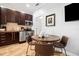 Well-equipped kitchen area featuring stainless steel appliances and dining table at 1020 Sun N Sea Dr # 104B, Sarasota, FL 34242