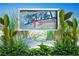 Sign showcasing Siesta Key as the #1 beach in the USA, surrounded by tropical plants at 1020 Sun N Sea Dr # 104B, Sarasota, FL 34242