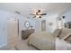 Bright bedroom features a ceiling fan and wood dresser at 1046 Greystone Ln, Sarasota, FL 34232