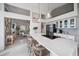 Bright kitchen features stainless appliances, a large island with barstool seating and an open floor plan at 1046 Greystone Ln, Sarasota, FL 34232