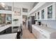 Bright kitchen features stainless appliances, light colored backsplash and white cabinets at 1046 Greystone Ln, Sarasota, FL 34232
