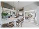 Bright kitchen features stainless appliances, a large island with barstool seating and an eat-in dining area at 1046 Greystone Ln, Sarasota, FL 34232