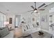 Bright living room featuring modern ceiling fan and open layout for easy entertaining at 1046 Greystone Ln, Sarasota, FL 34232