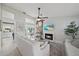 Bright living room boasts a cozy fireplace, modern ceiling fan, and stylish decor at 1046 Greystone Ln, Sarasota, FL 34232