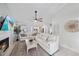 Bright, spacious living room with fireplace, ceiling fan, and large windows at 1046 Greystone Ln, Sarasota, FL 34232