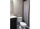 This bathroom features a toilet next to a shower with a shower curtain at 11702 Tetrafin Dr, Riverview, FL 33579