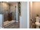 Modern bathroom with a glass-enclosed shower and elegant fixtures at 11702 Tetrafin Dr, Riverview, FL 33579